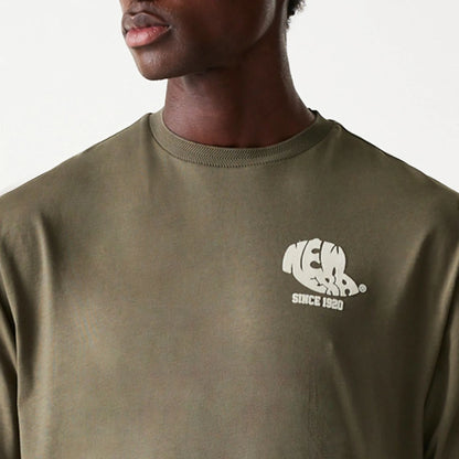 The Male model is wearing New Era Graphic Green Oversized T-Shirt 6