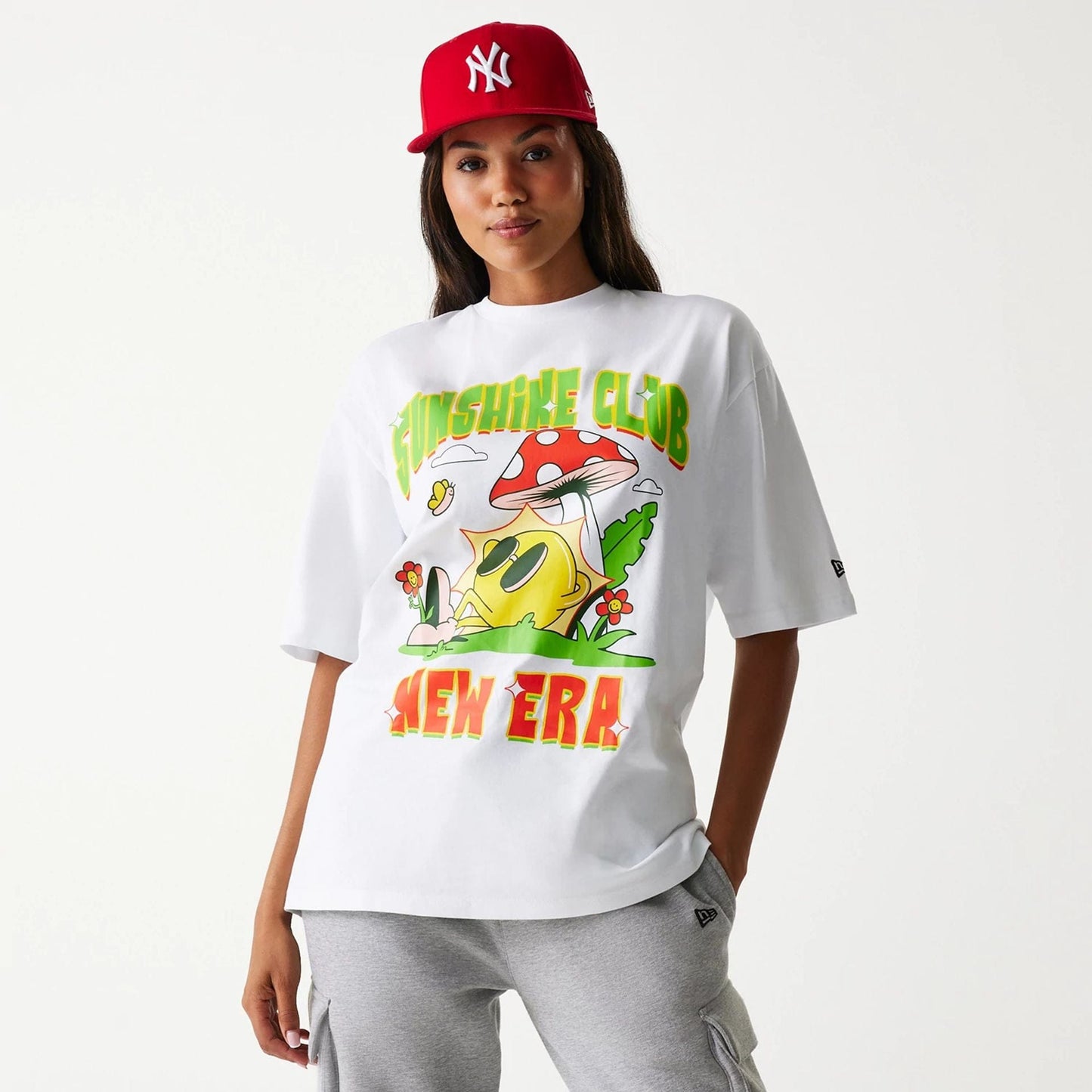 The Male model is wearing New Era Outdoor Graphic White Oversized T-Shirt 4