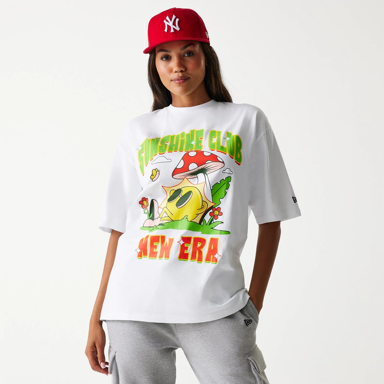 The Male model is wearing New Era Outdoor Graphic White Oversized T-Shirt 4