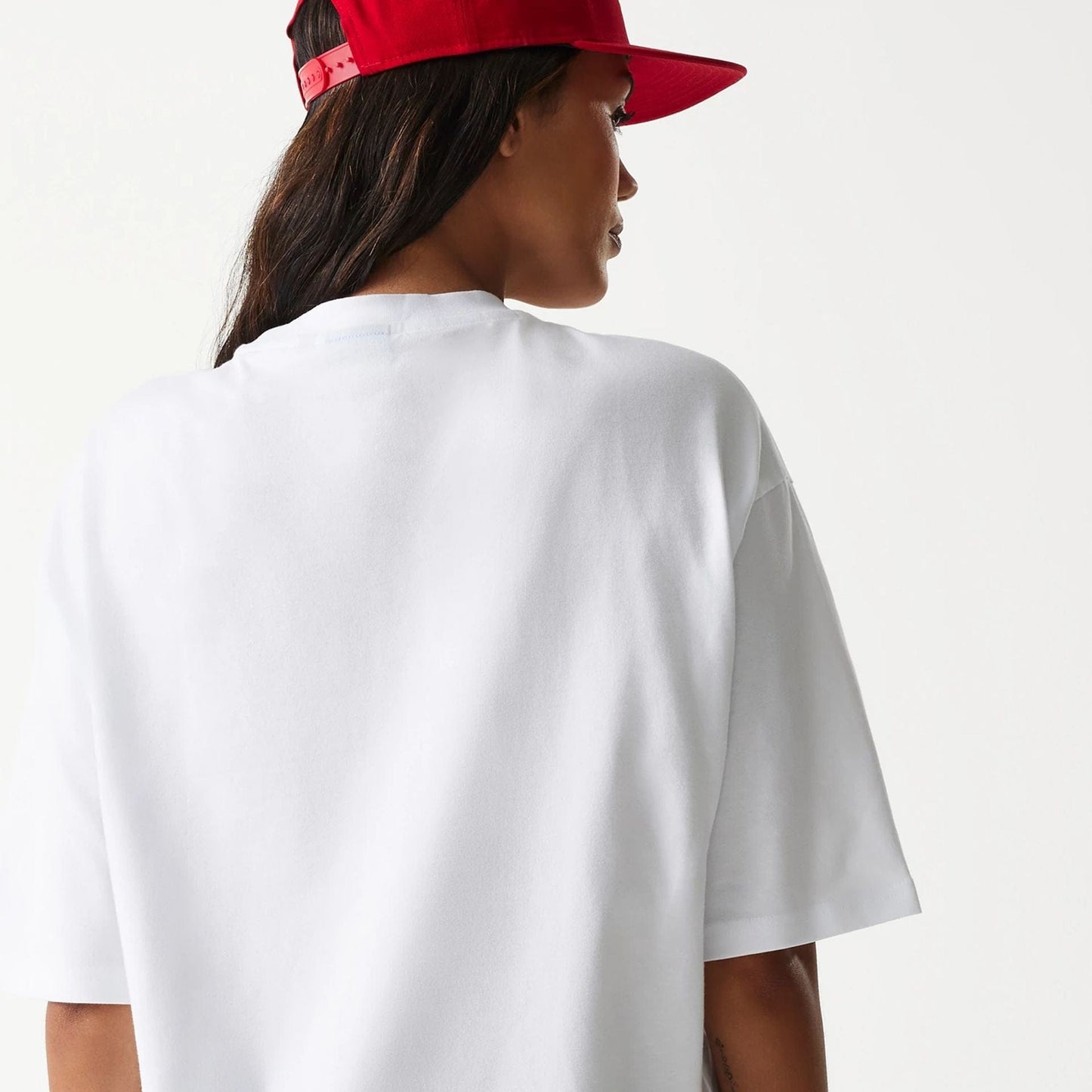 The Male model is wearing New Era Outdoor Graphic White Oversized T-Shirt 8