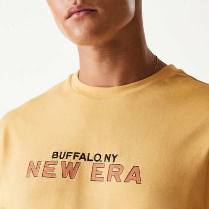 The Male model is wearing New Era Vacation Graphic Beige Oversized T-Shirt 7