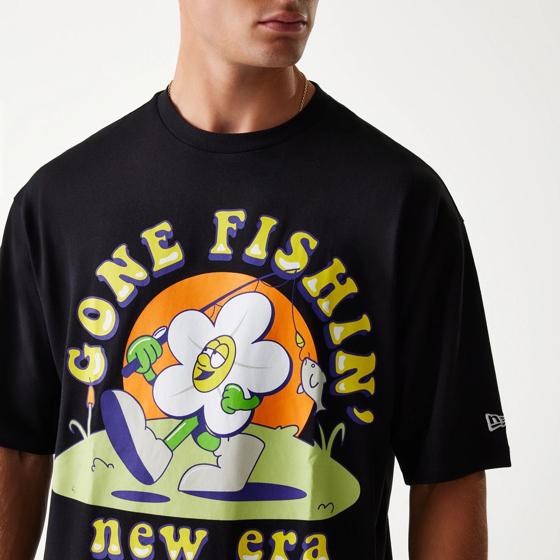 The Male model is wearing New Era Outdoor Graphic Black Oversized T-Shirt 5