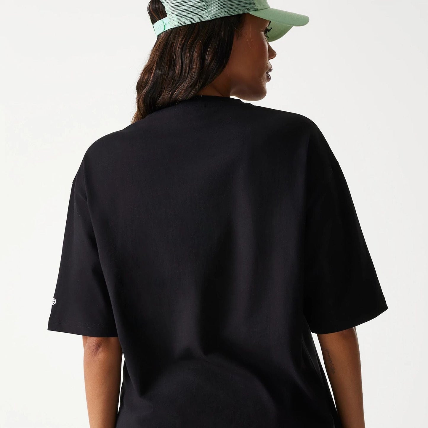 The Male model is wearing New Era Outdoor Graphic Black Oversized T-Shirt 8