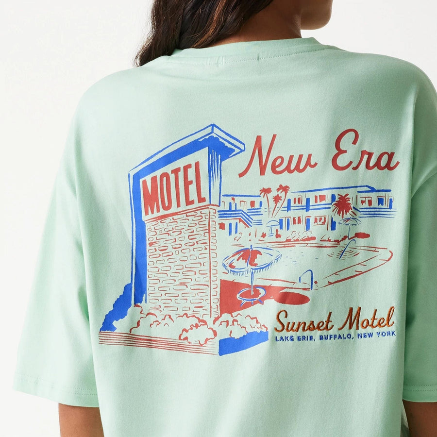 The Male model is wearing New Era Vacation Graphic Pastel Green Oversized T-Shirt 5