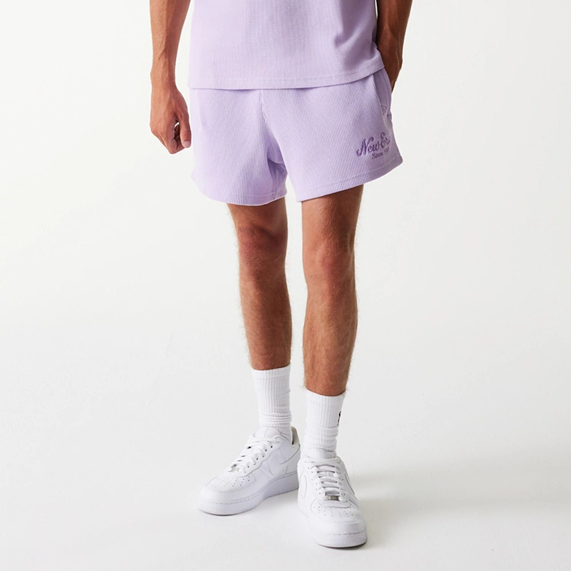 The Male model is wearing New Era Waffle Pastel Purple Shorts 3
