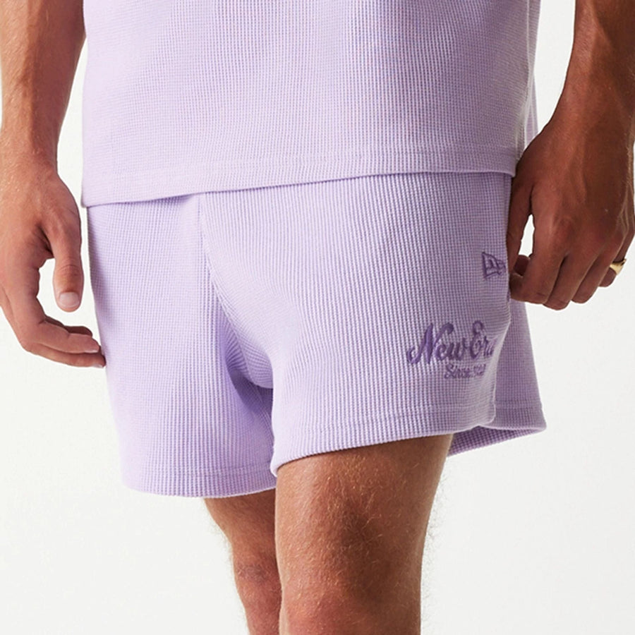 The Male model is wearing New Era Waffle Pastel Purple Shorts 5