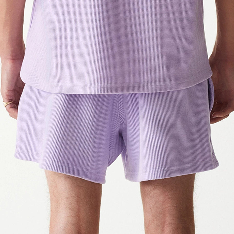 The Male model is wearing New Era Waffle Pastel Purple Shorts 6