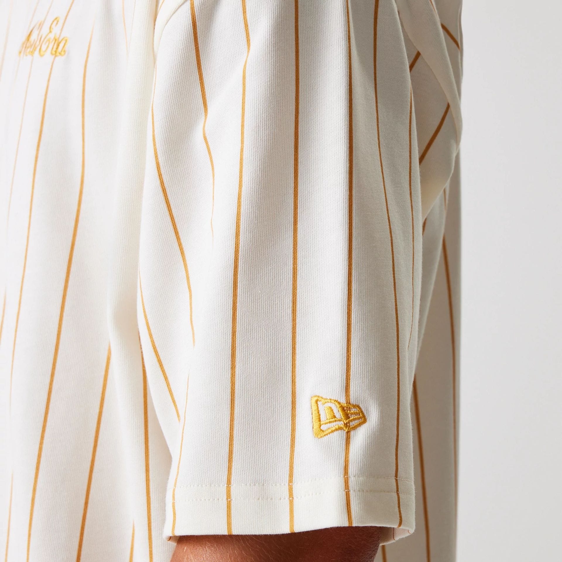 The Male model is wearing New Era Pinstripe Open White Oversized T-Shirt 8