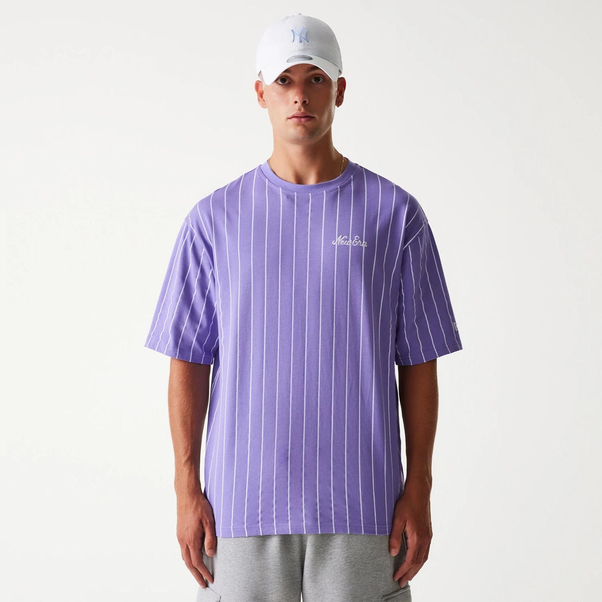 The Male model is wearing New Era Pinstripe Purple Oversized T-Shirt 4