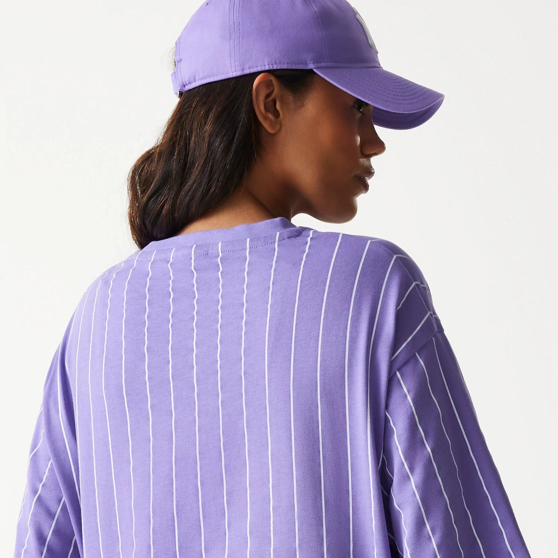 The Male model is wearing New Era Pinstripe Purple Oversized T-Shirt 5