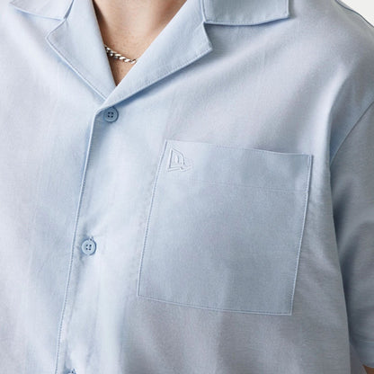 The Male model is wearing New Era Pastel Blue Revere Short Sleeve Shirt 4