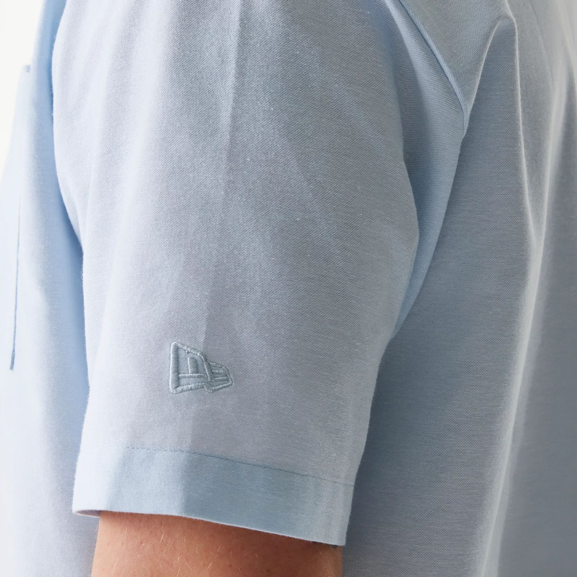 The Male model is wearing New Era Pastel Blue Revere Short Sleeve Shirt 5