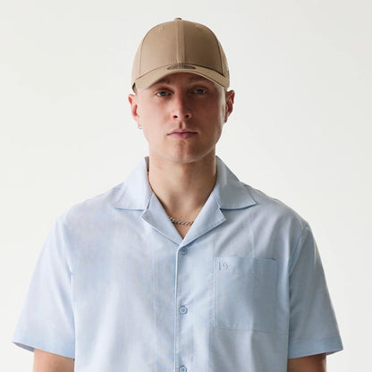 The Male model is wearing New Era Pastel Blue Revere Short Sleeve Shirt 6