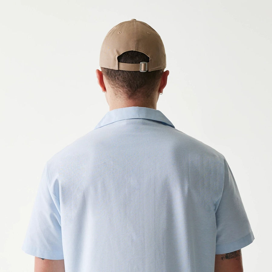 The Male model is wearing New Era Pastel Blue Revere Short Sleeve Shirt 7