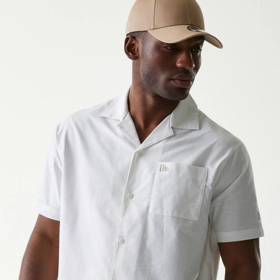 The Male model is wearing New Era White Revere Short Sleeve Shirt 3