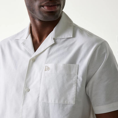 The Male model is wearing New Era White Revere Short Sleeve Shirt 4