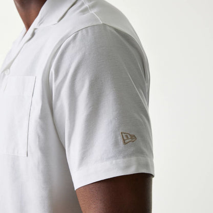 The Male model is wearing New Era White Revere Short Sleeve Shirt 5