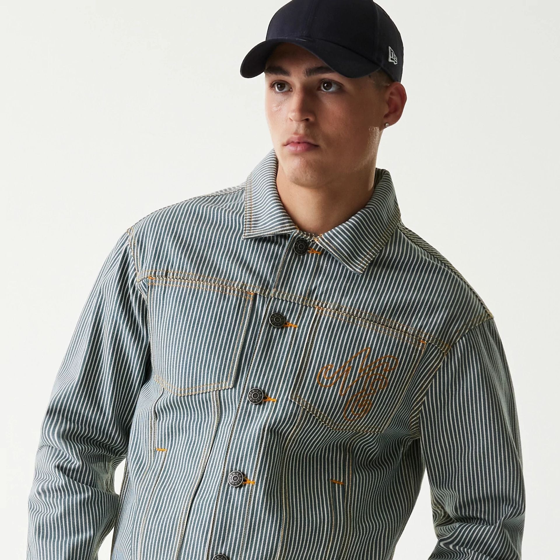The Male model is wearing New Era Blue Denim Jacket 7