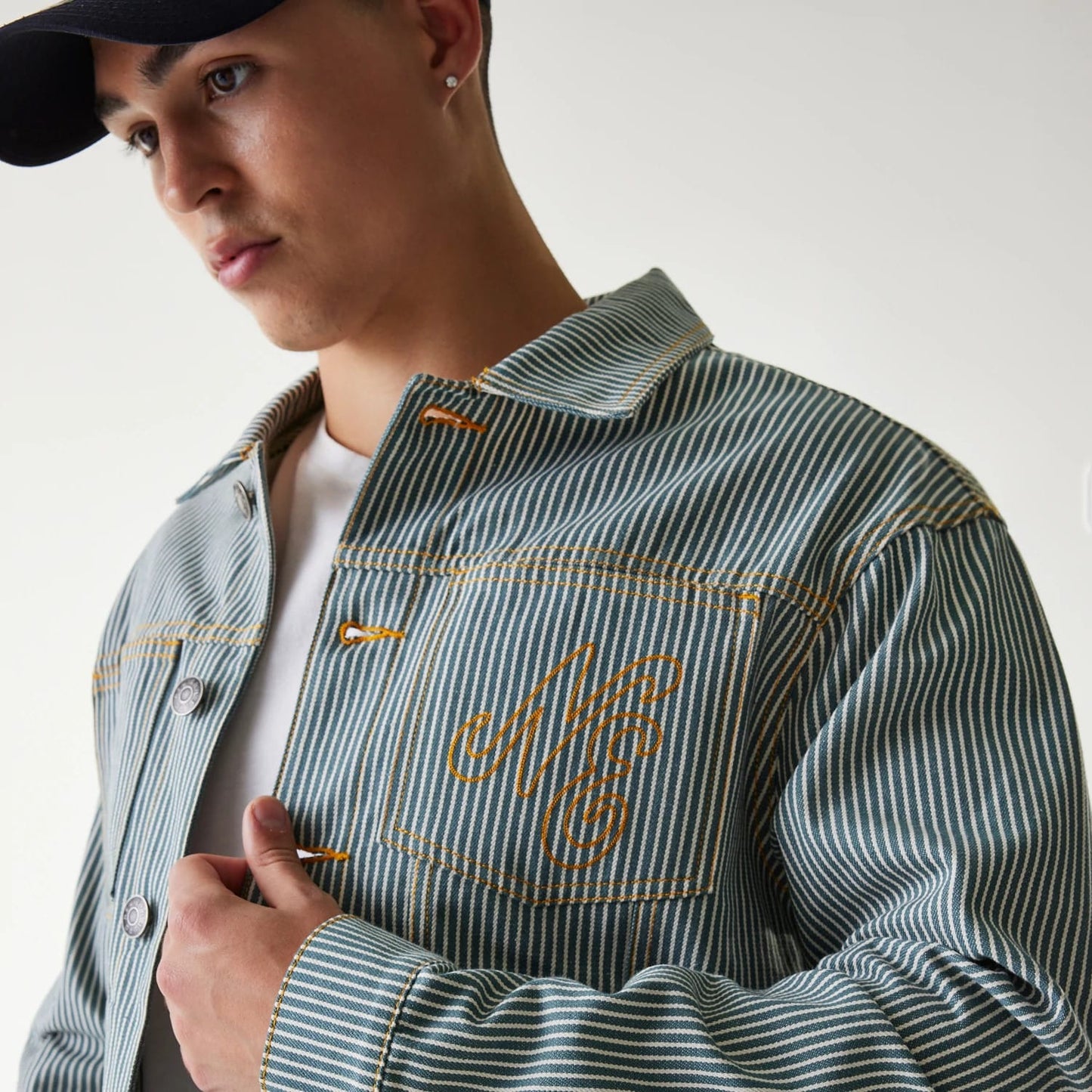 The Male model is wearing New Era Blue Denim Jacket 4