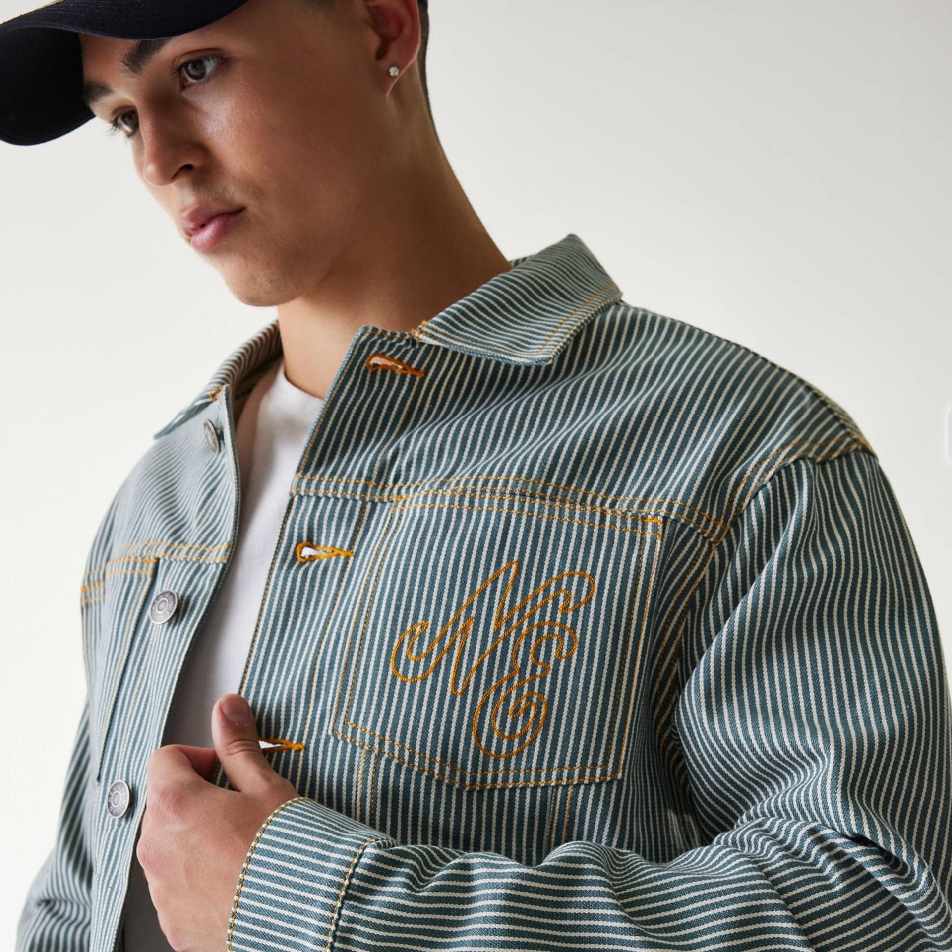 The Male model is wearing New Era Blue Denim Jacket 4