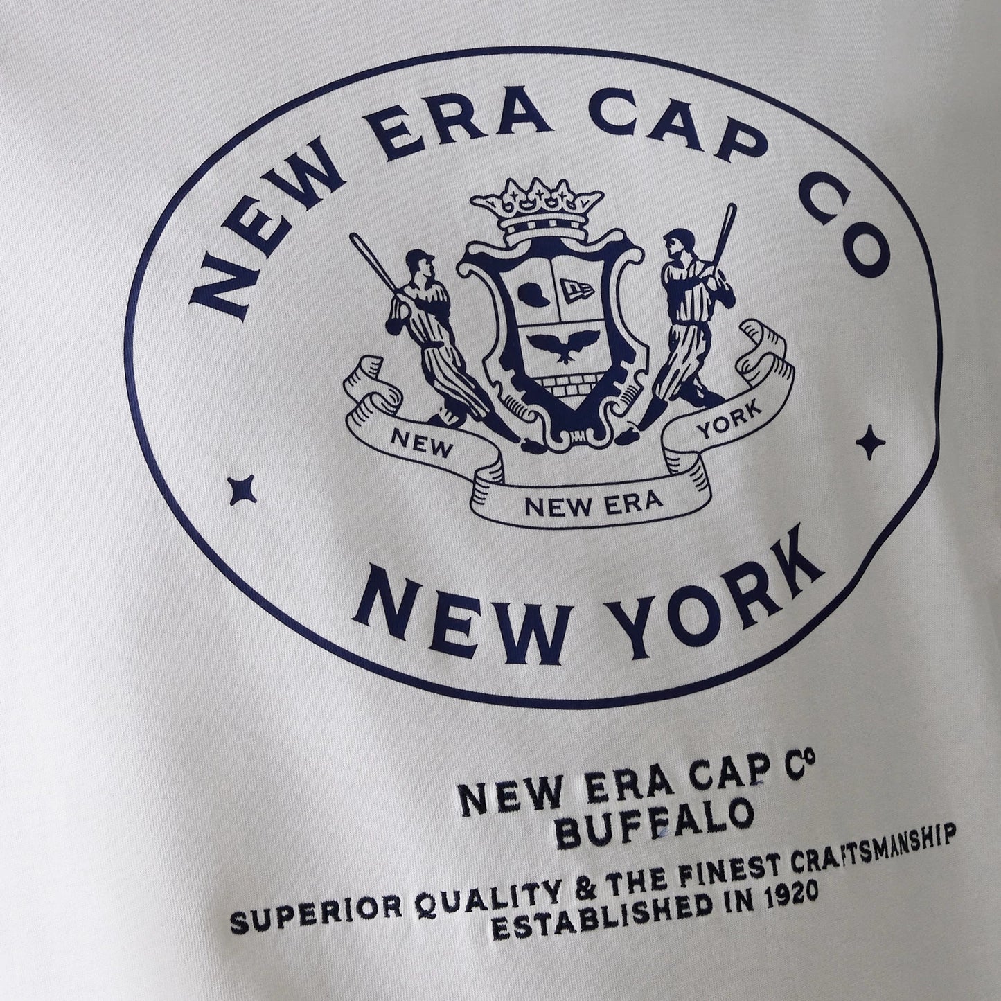 The Male model is wearing New Era Crest White Oversized T-Shirt 5
