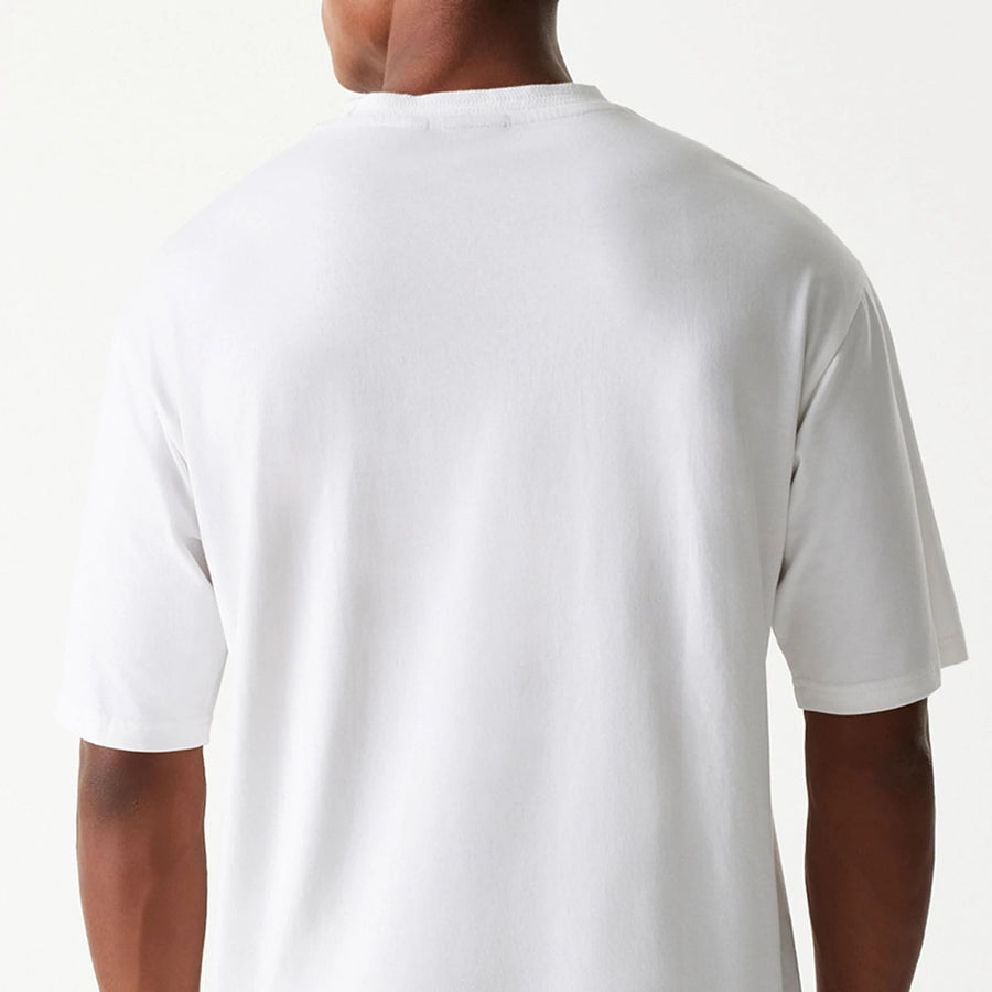 The Male model is wearing New Era Crest White Oversized T-Shirt 7