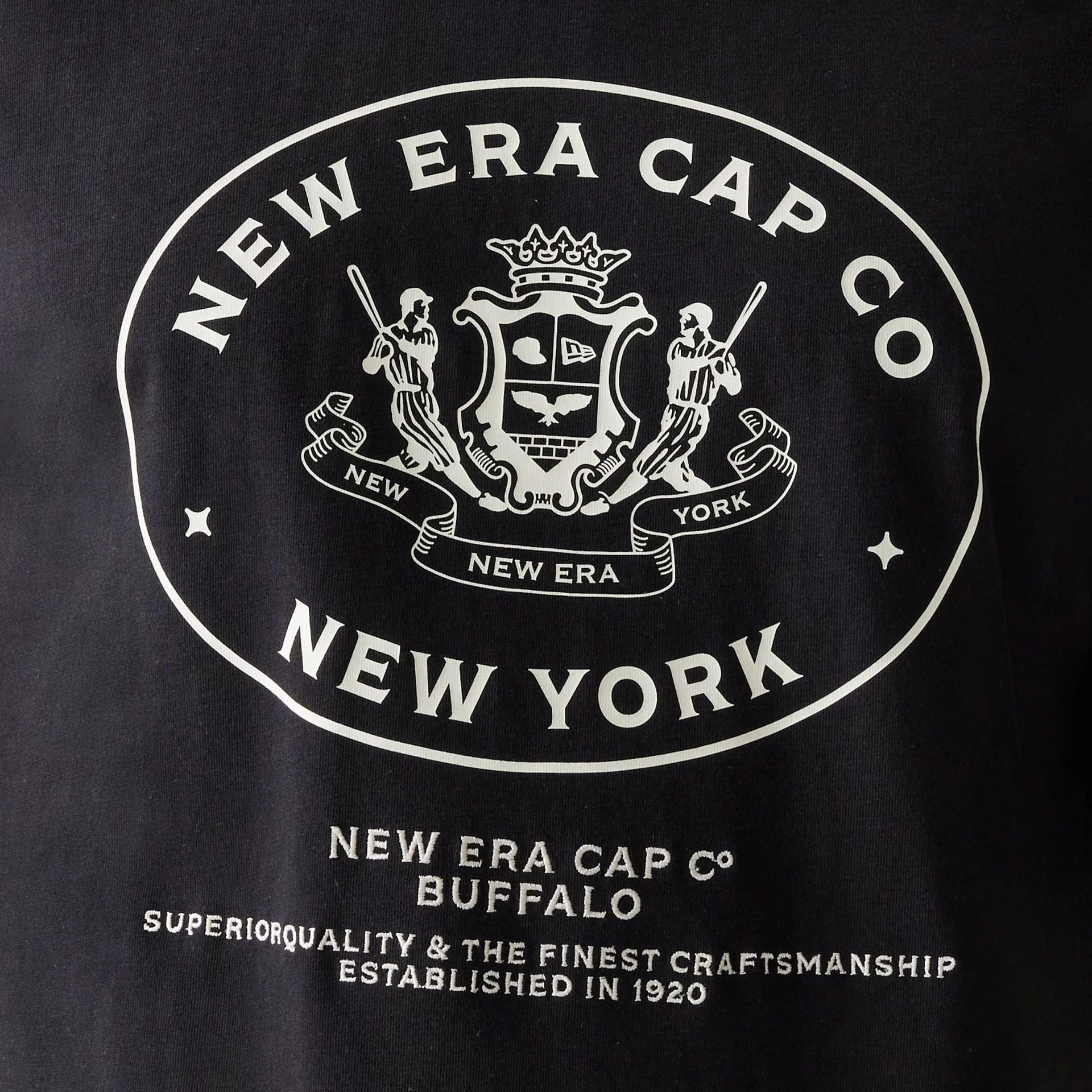 The Male model is wearing New Era Crest Black Oversized T-Shirt 4