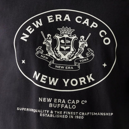 The Male model is wearing New Era Crest Black Oversized T-Shirt 4