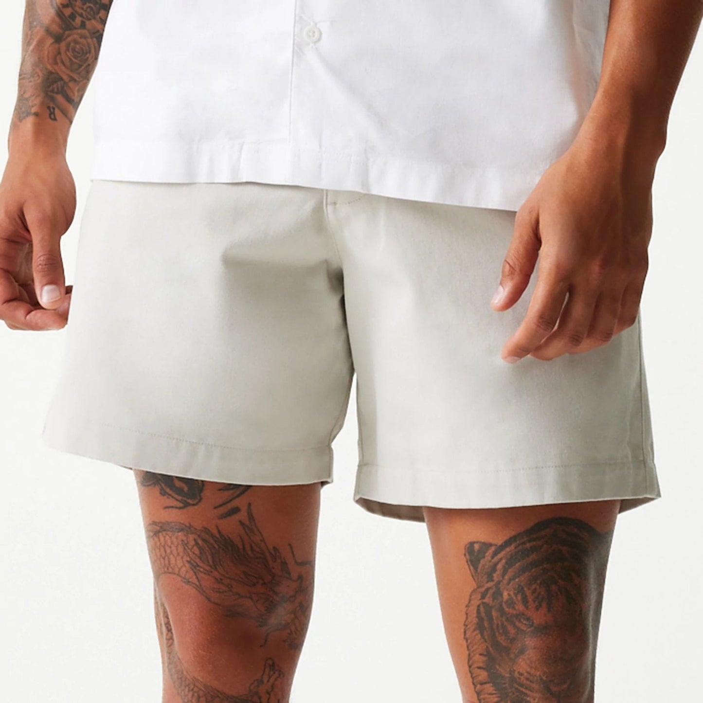 The Male model is wearing New Era Cream Chino Shorts 4