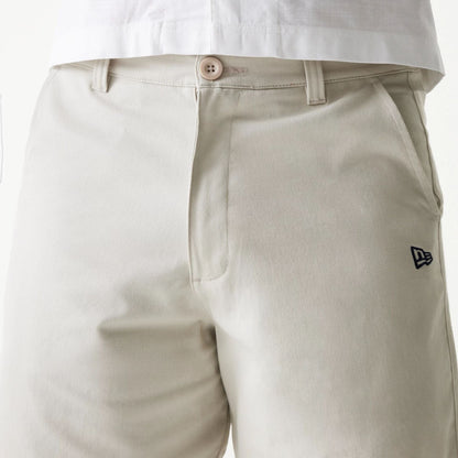 The Male model is wearing New Era Cream Chino Shorts 3