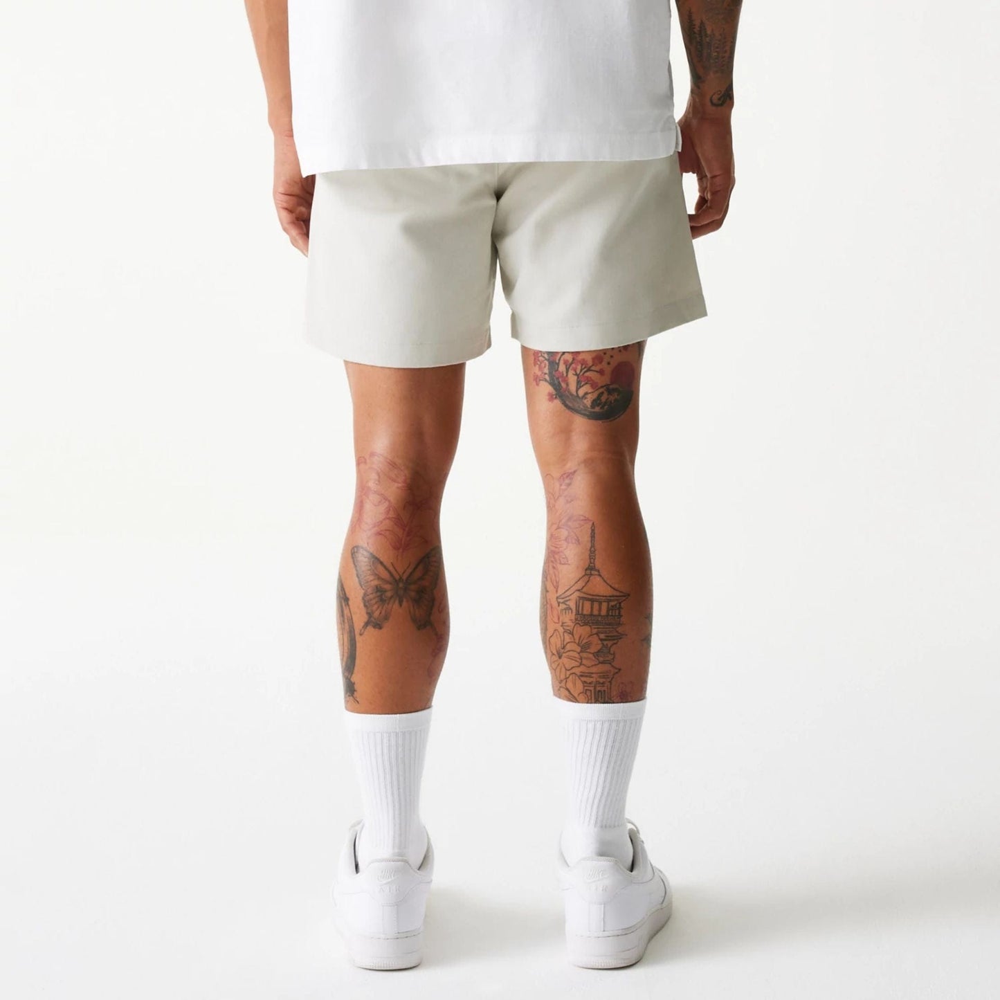 The Male model is wearing New Era Cream Chino Shorts 6