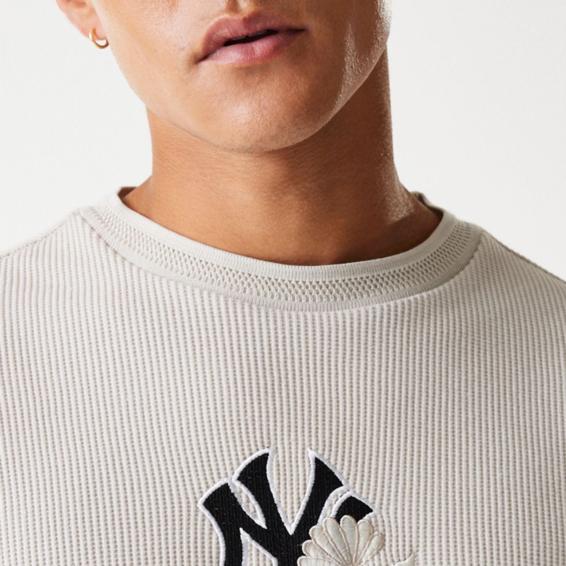 The Male model is wearing New York Yankees MLB Waffle Cream Oversized Crew Neck Sweater 5