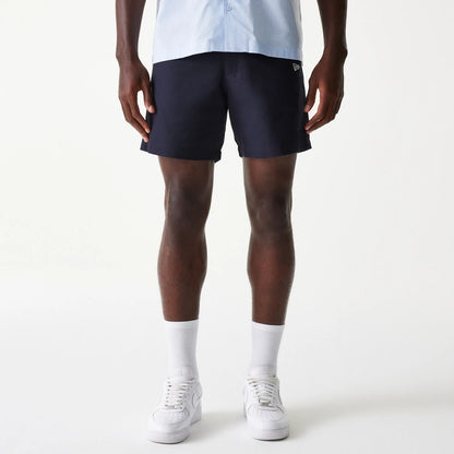 The Male model is wearing New Era Navy Chino Shorts 1