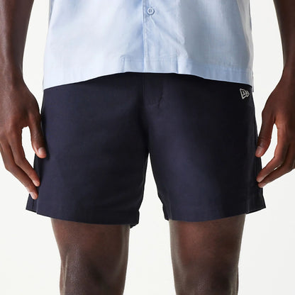 The Male model is wearing New Era Navy Chino Shorts 6