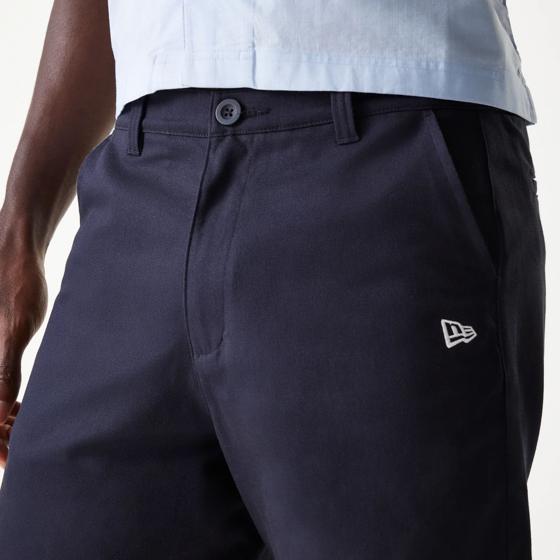 The Male model is wearing New Era Navy Chino Shorts 4