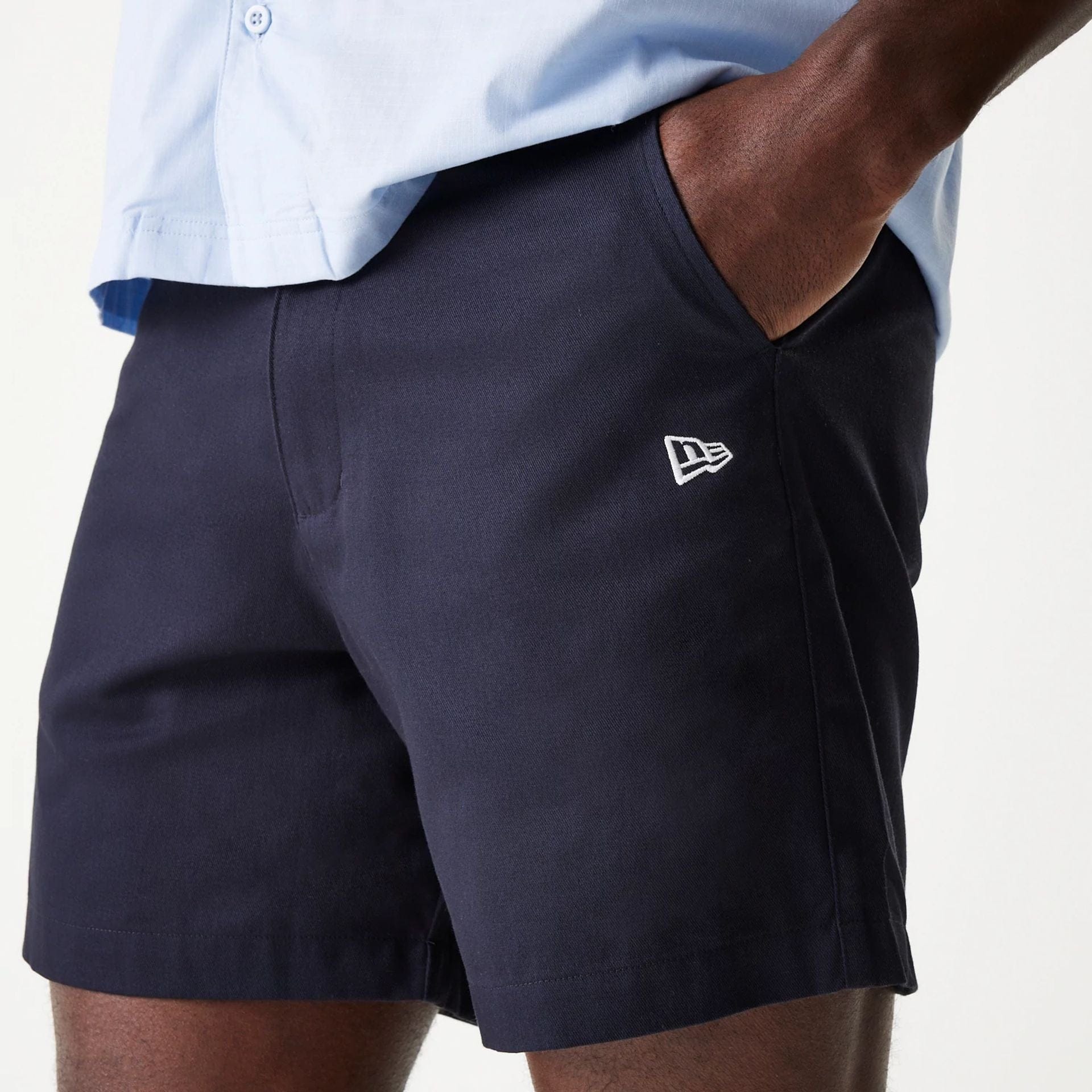 The Male model is wearing New Era Navy Chino Shorts 3
