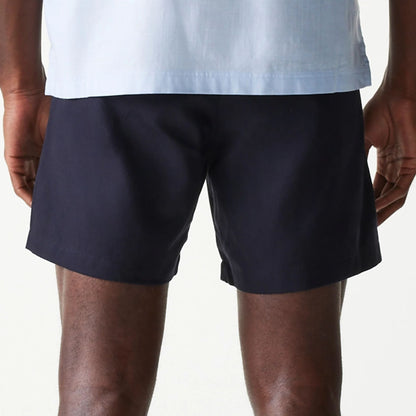 The Male model is wearing New Era Navy Chino Shorts 7