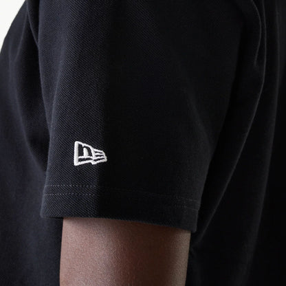 The Male model is wearing New Era Drop Shoulder Black Polo Shirt 5