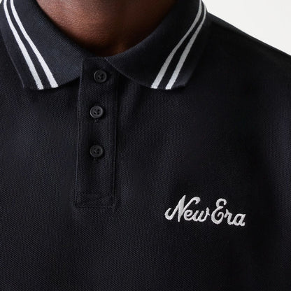The Male model is wearing New Era Drop Shoulder Black Polo Shirt 6