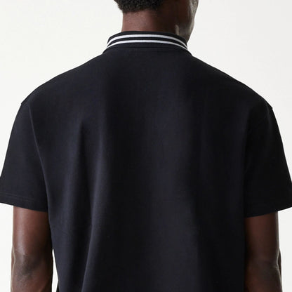 The Male model is wearing New Era Drop Shoulder Black Polo Shirt 7