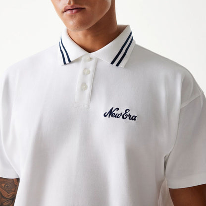 The Male model is wearing New Era Drop Shoulder White Polo Shirt 4