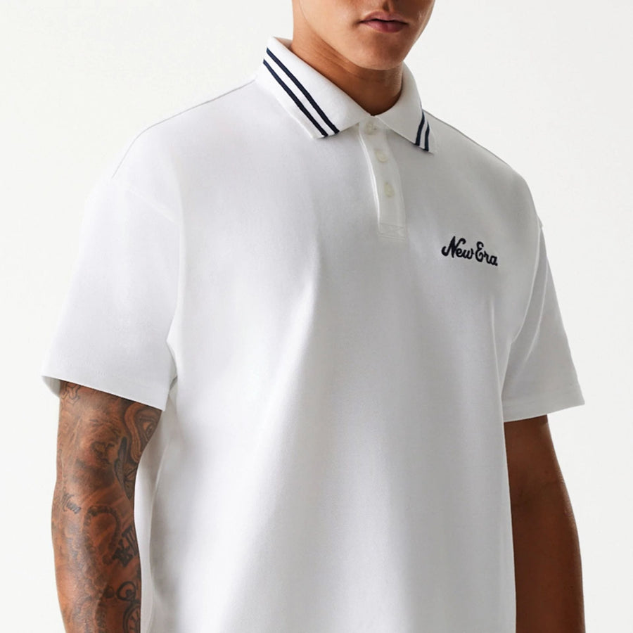 The Male model is wearing New Era Drop Shoulder White Polo Shirt 3