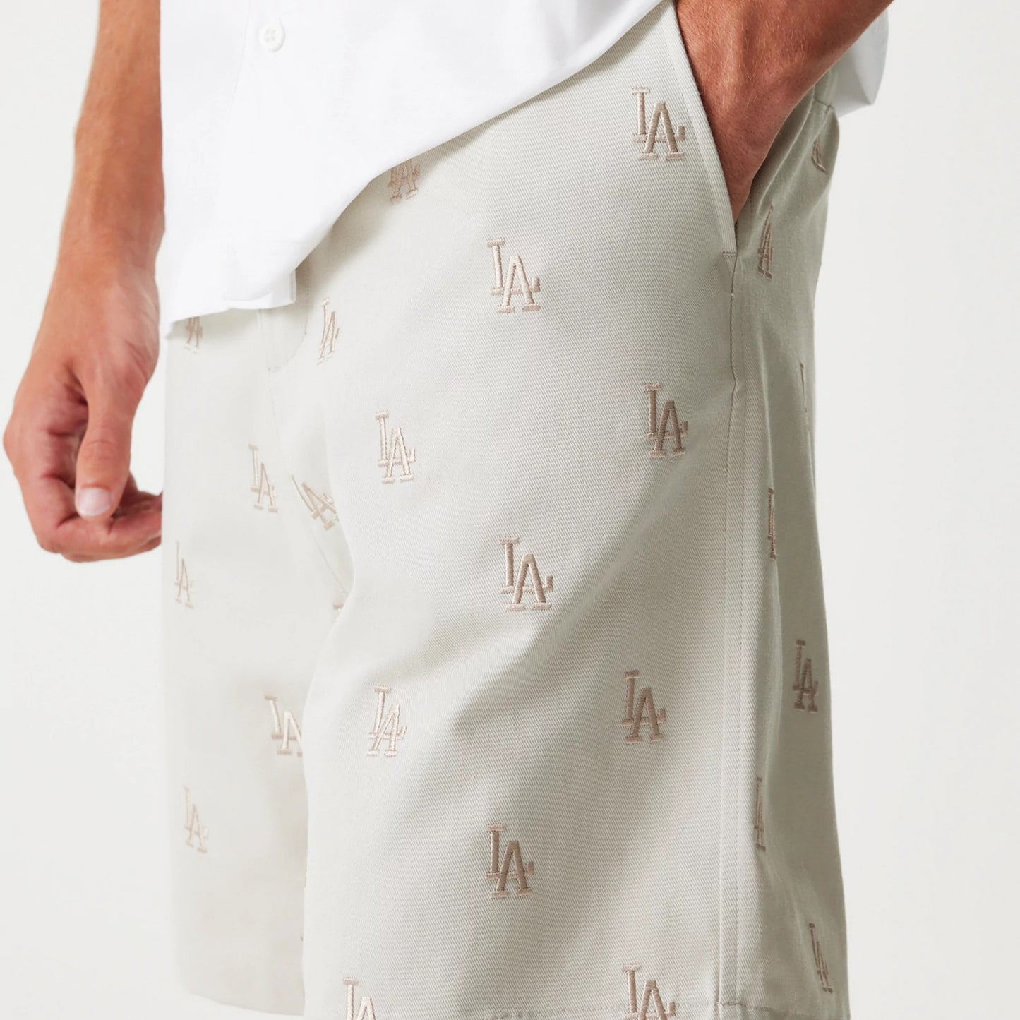 The Male model is wearing LA Dodgers MLB Monogram Cream Shorts 5