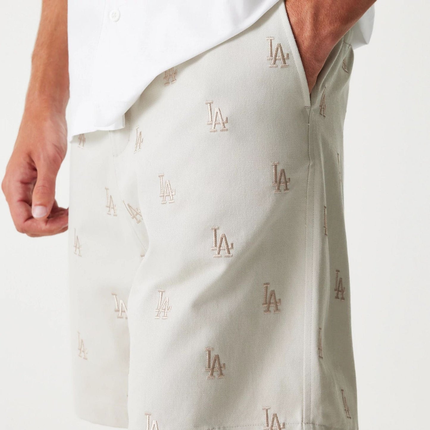 The Male model is wearing LA Dodgers MLB Monogram Cream Shorts 5