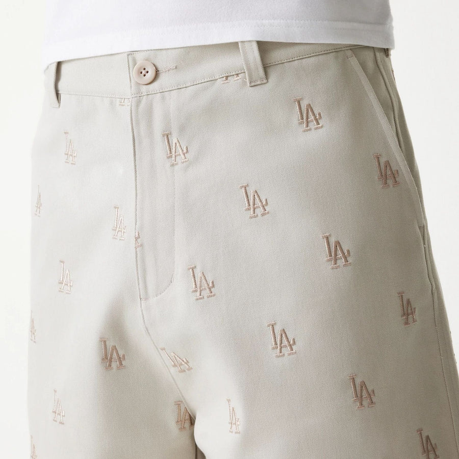 The Male model is wearing LA Dodgers MLB Monogram Cream Shorts 6