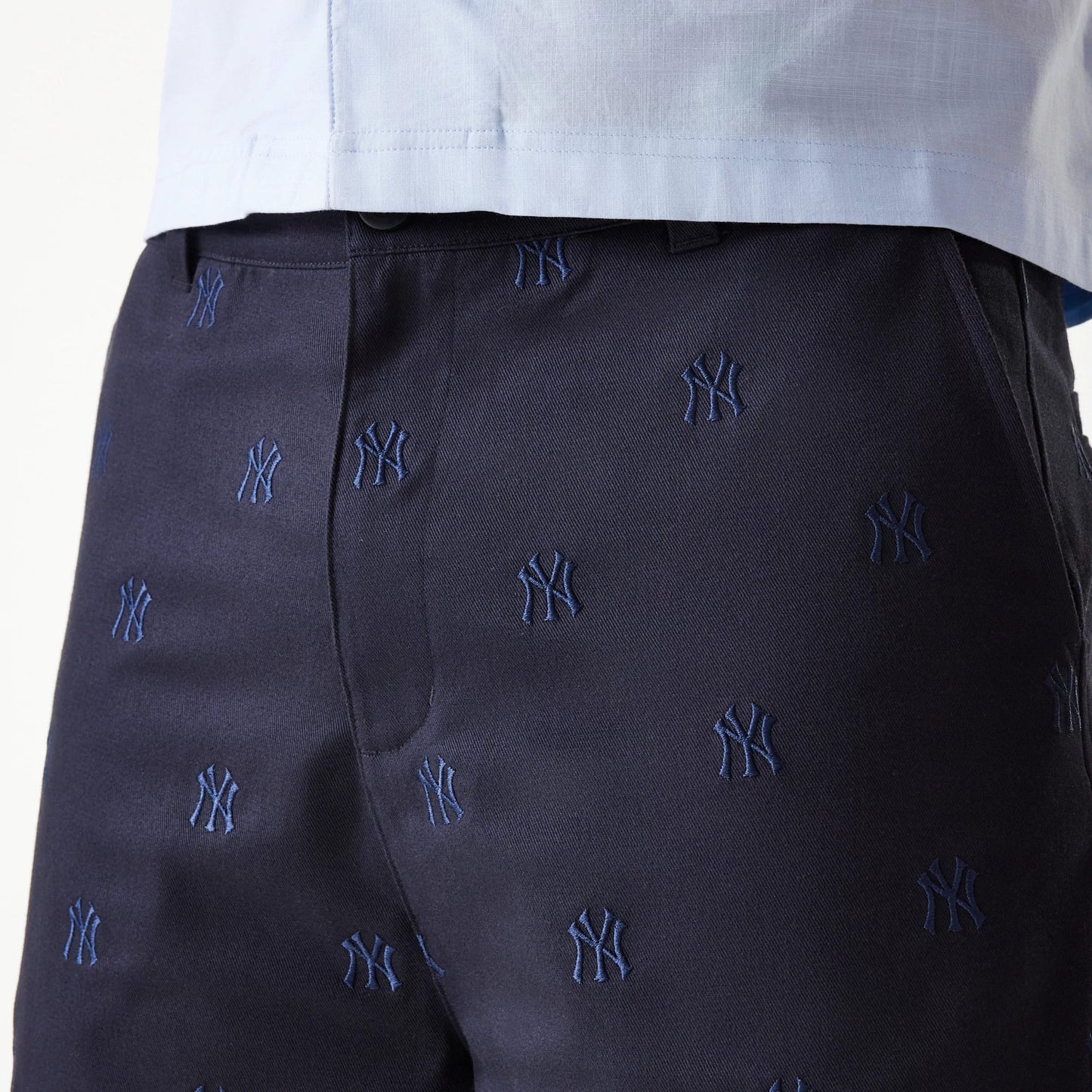 The Male model is wearing New York Yankees MLB Monogram Navy Shorts 5