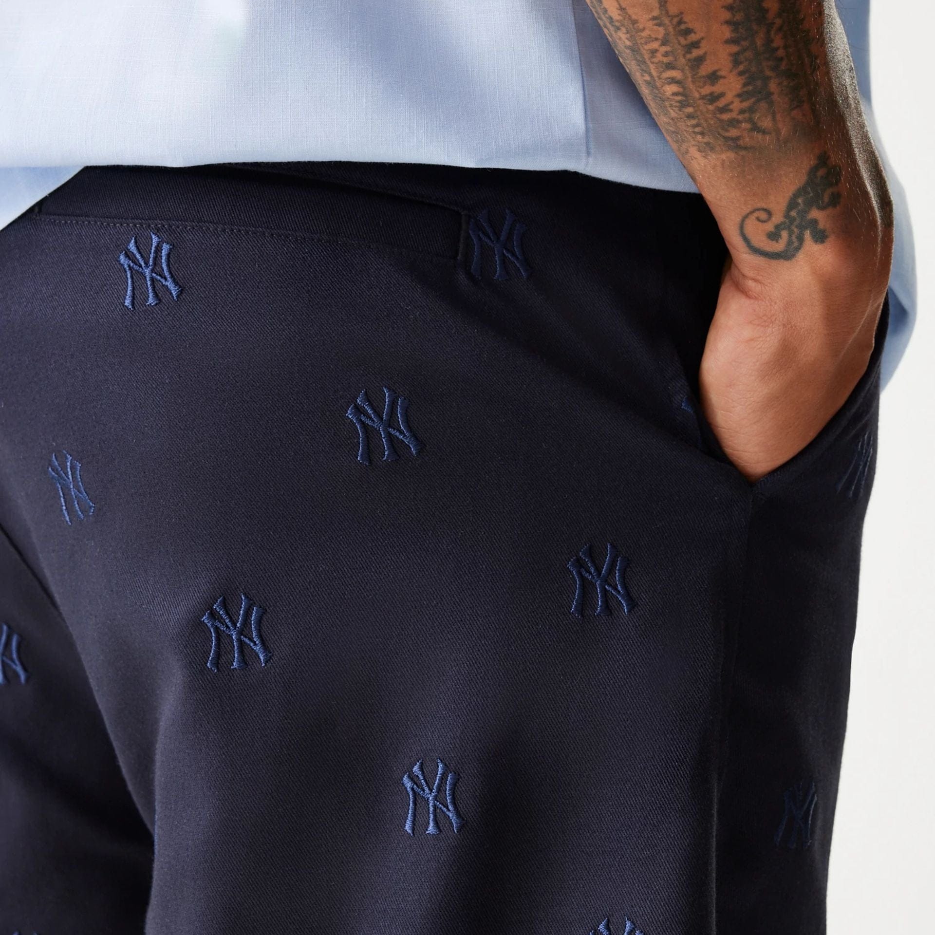 The Male model is wearing New York Yankees MLB Monogram Navy Shorts 7