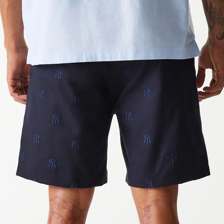 The Male model is wearing New York Yankees MLB Monogram Navy Shorts 6