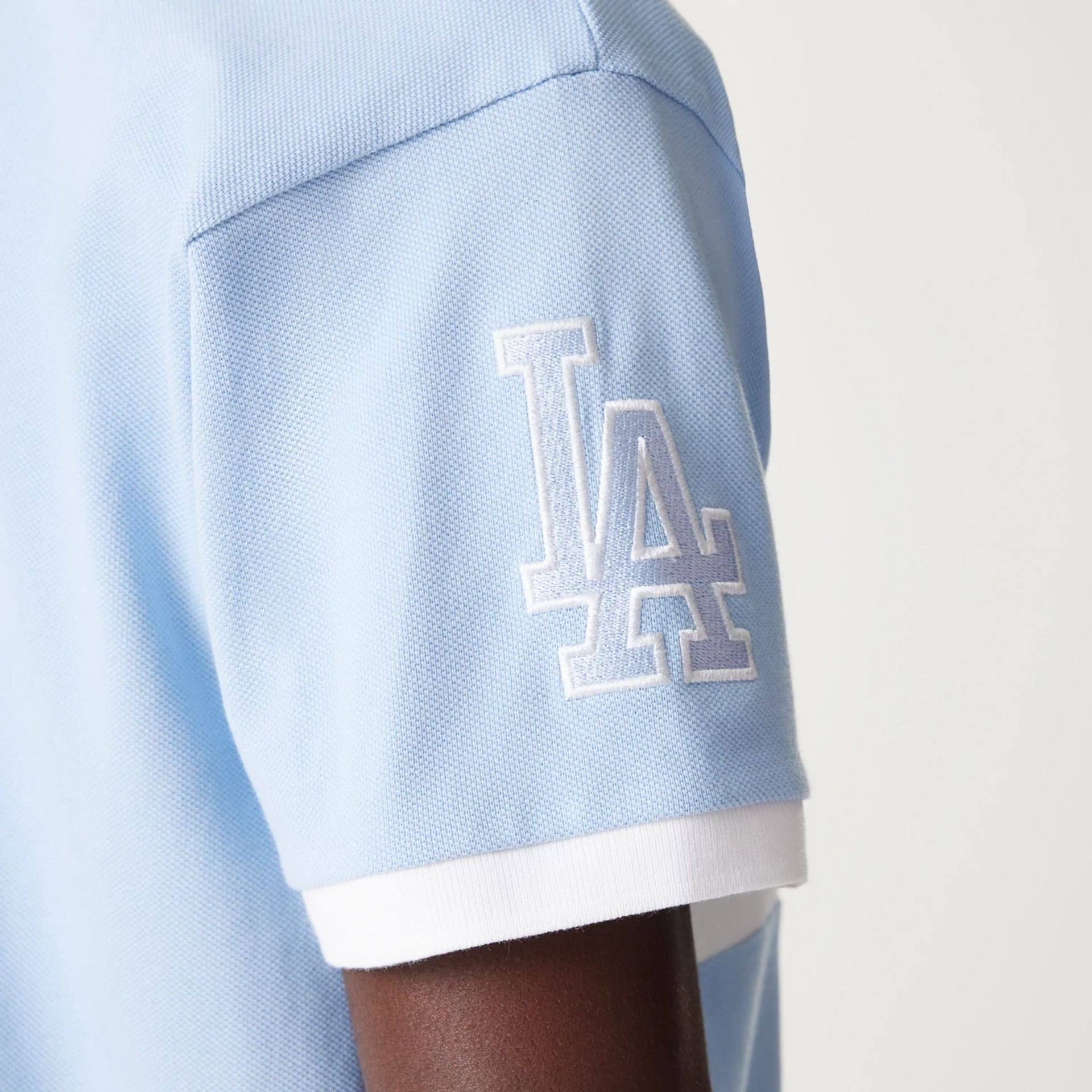 The Male model is wearing LA Dodgers MLB Graphic Pastel Blue Polo Shirt 5