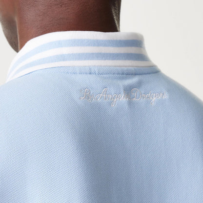The Male model is wearing LA Dodgers MLB Graphic Pastel Blue Polo Shirt 4